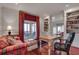 Elegant home office boasts hardwood floors, custom bookshelves, and access to the screened in porch at 24 Ball Creek Hl, Atlanta, GA 30350