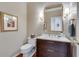 Stylish powder room with modern vanity, elegant mirror, and sophisticated fixtures at 24 Ball Creek Hl, Atlanta, GA 30350