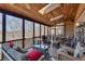Cozy screened-in porch features a wood-paneled ceiling with skylights and comfortable seating at 24 Ball Creek Hl, Atlanta, GA 30350