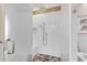 Shower stall with white tile, bench, mosaic accents, and sleek glass door showcases modern bathroom design at 24 Ball Creek Hl, Atlanta, GA 30350
