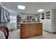 Large walk-in closet with center island, custom shelves and drawers, and window seating and natural lighting at 24 Ball Creek Hl, Atlanta, GA 30350