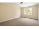 Bright and sunny bedroom featuring neutral carpeting and refreshing natural light from the large windows at 276 Atlanta Se Ave, Atlanta, GA 30315