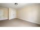 Spacious bedroom features neutral carpeting, double closet, and crisp white trim throughout at 276 Atlanta Se Ave, Atlanta, GA 30315