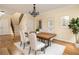 Dining room with hardwood floors, chandelier lighting, and easy access to the staircase at 276 Atlanta Se Ave, Atlanta, GA 30315
