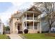 Charming two-story home featuring a double front porch, landscaped yard, and inviting curb appeal at 276 Atlanta Se Ave, Atlanta, GA 30315