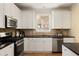 Well-maintained kitchen with stainless steel appliances, granite countertops, and a window view at 276 Atlanta Se Ave, Atlanta, GA 30315