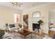 Cozy living room with a fireplace, hardwood floors, stylish decor, and an open concept design at 276 Atlanta Se Ave, Atlanta, GA 30315