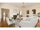 Cozy living room with a fireplace, hardwood floors, stylish decor, and lots of natural light at 276 Atlanta Se Ave, Atlanta, GA 30315