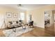 Inviting living room boasts hardwood floors, neutral paint, stylish decor and is filled with natural light at 276 Atlanta Se Ave, Atlanta, GA 30315