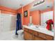 Standard bathroom with a shower-tub combo, a vanity, and toilet at 308 Paper Woods Dr, Lawrenceville, GA 30046