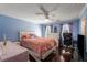 Stylish bedroom with hardwood flooring, a ceiling fan, and a comfortable layout at 308 Paper Woods Dr, Lawrenceville, GA 30046
