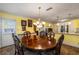 Dining room with ornamental table and chairs with kitchen access at 308 Paper Woods Dr, Lawrenceville, GA 30046