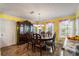 Elegant dining room with large windows and ornate furniture at 308 Paper Woods Dr, Lawrenceville, GA 30046