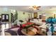 Inviting living room showcasing a cozy seating area, a staircase, and a view into the kitchen area at 308 Paper Woods Dr, Lawrenceville, GA 30046