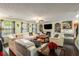 Spacious living room featuring a fireplace, built-in shelving, and comfortable seating arrangement at 308 Paper Woods Dr, Lawrenceville, GA 30046