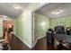 Home office space with hardwood flooring, natural light, and french doors for privacy at 308 Paper Woods Dr, Lawrenceville, GA 30046