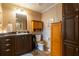 The bathroom features tile flooring, a granite countertop and wood cabinetry at 7024 Evergreen Way, Buford, GA 30518