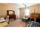 The bedroom features a large window, room for an office and exercise equipment at 7024 Evergreen Way, Buford, GA 30518