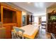 Spacious open-concept dining area with a bright table set and view of the living area at 7024 Evergreen Way, Buford, GA 30518