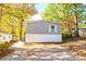 Home with a spacious front yard and a convenient driveway at 7024 Evergreen Way, Buford, GA 30518
