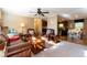 Spacious open-concept living area with plush seating, and a view of the kitchen and dining area at 7024 Evergreen Way, Buford, GA 30518