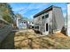 New construction home featuring a backyard with a retaining wall, lawn, and a small patio area at 8The07 Stickley Oak Way, Woodstock, GA 30189