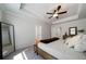 Bright bedroom with a ceiling fan, large mirror, and neutral walls and carpet at 8The07 Stickley Oak Way, Woodstock, GA 30189