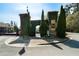 The Village at Towne Lake entrance with beautiful landscaping and signage at 8The07 Stickley Oak Way, Woodstock, GA 30189
