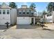 Charming two-story home with a modern exterior, featuring a gray facade and a spacious two-car garage at 8The07 Stickley Oak Way, Woodstock, GA 30189