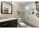 Modern bathroom featuring a marble vanity, stylish shower, and contemporary fixtures and tile at 2296 Raven Cir, Lithonia, GA 30058