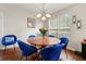 Cozy dining area with a modern light fixture and a view of the backyard through a window at 2296 Raven Cir, Lithonia, GA 30058