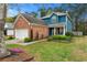 Charming two-story brick home with a well-manicured lawn and a two car garage at 2296 Raven Cir, Lithonia, GA 30058