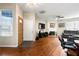 Inviting living room with hardwood floors, a fireplace, and a large window with natural light at 2296 Raven Cir, Lithonia, GA 30058