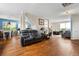 Spacious open-concept living room with hardwood floors, a fireplace, and plenty of natural light at 2296 Raven Cir, Lithonia, GA 30058