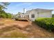 Expansive backyard with a deck, green lawn, and mature trees, offering ample space for outdoor enjoyment at 500 Meadowmeade Ln, Lawrenceville, GA 30043