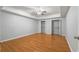 Bedroom features laminate floors, two closets, and recessed ceiling at 500 Meadowmeade Ln, Lawrenceville, GA 30043