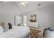 Bedroom with a sitting area features high ceilings, a ceiling fan, and an open floor plan at 500 Meadowmeade Ln, Lawrenceville, GA 30043