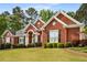 Attractive brick home with a well-kept lawn and manicured landscaping at 500 Meadowmeade Ln, Lawrenceville, GA 30043