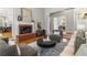 Living room boasts a brick fireplace, hardwood floors, and an open layout at 500 Meadowmeade Ln, Lawrenceville, GA 30043