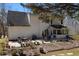 Large backyard featuring a patio and garden area, perfect for outdoor relaxation and activities at 6972 Sandtown Ln, Stone Mountain, GA 30087