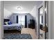 Attic bedroom with a cozy feel and a mirrored closet door at 6972 Sandtown Ln, Stone Mountain, GA 30087