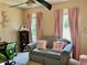 Bedroom designed with a modern workspace area bathed in natural light from two windows at 6972 Sandtown Ln, Stone Mountain, GA 30087