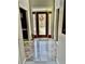 Foyer with red front door, decorative wreath, and marbled tile floor at 6972 Sandtown Ln, Stone Mountain, GA 30087