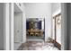 Entryway view into dining room featuring marble floor, high ceilings, and neutral decor at 6972 Sandtown Ln, Stone Mountain, GA 30087