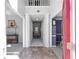 Bright, two-story foyer with marble flooring and traditional columns at 6972 Sandtown Ln, Stone Mountain, GA 30087