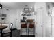 Open-concept kitchen with white cabinets, granite countertops, and bar-stool seating at 6972 Sandtown Ln, Stone Mountain, GA 30087