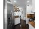Spacious kitchen with stainless steel appliances and stone countertops overlooking an adjacent breakfast area at 6972 Sandtown Ln, Stone Mountain, GA 30087