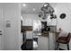 Open-concept kitchen featuring granite countertops and bar-stool seating at 6972 Sandtown Ln, Stone Mountain, GA 30087