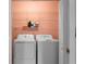 Convenient laundry closet with modern washer and dryer, plus shelving for storage at 6972 Sandtown Ln, Stone Mountain, GA 30087