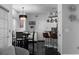 Open concept living area with modern lighting, dining space, and seating at 6972 Sandtown Ln, Stone Mountain, GA 30087